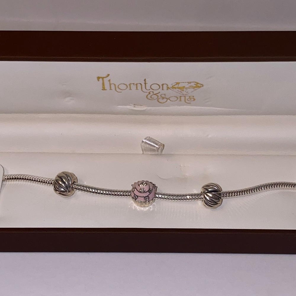 Thornton & Sons silver cupcake charm bracelet.